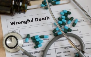 Wrongful death form, pills and a stethoscope